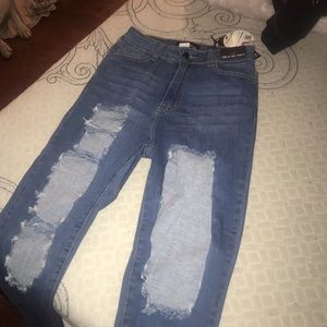 Distressed denim jeans
